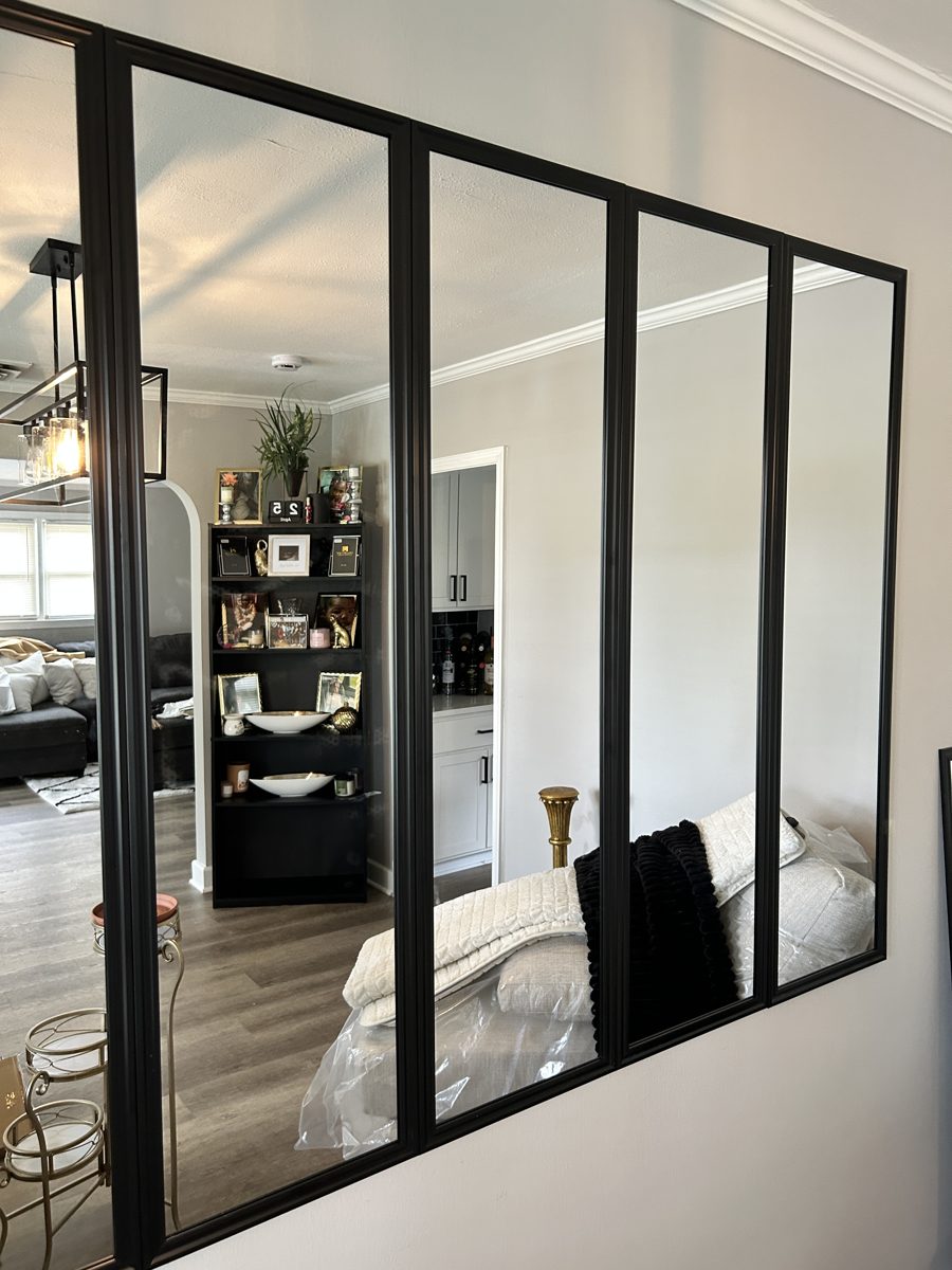 Completed black-framed mirror installation by DJ Did It