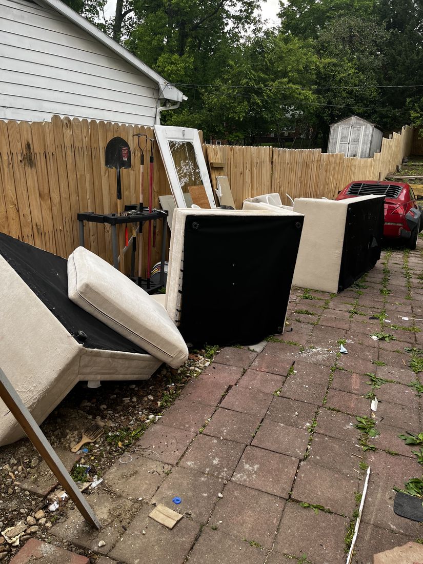 Furniture and bulk items piled up before a Baltimore haul-off