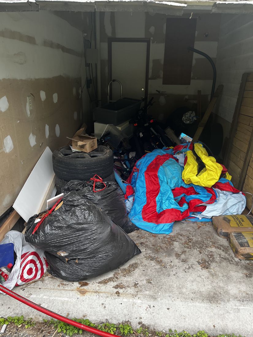 Cluttered Baltimore garage during a cleanout