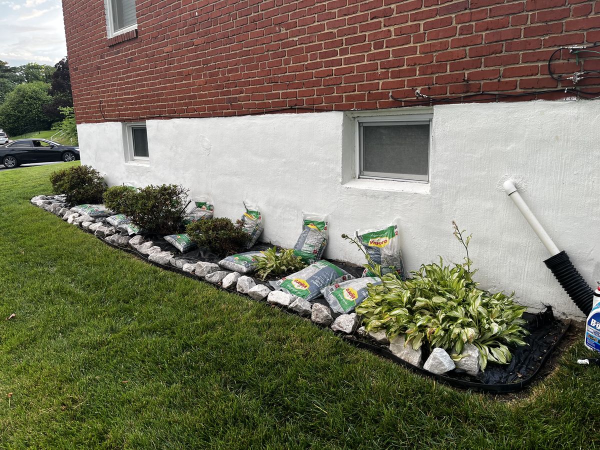 Side rock bed installation in progress at a Baltimore home