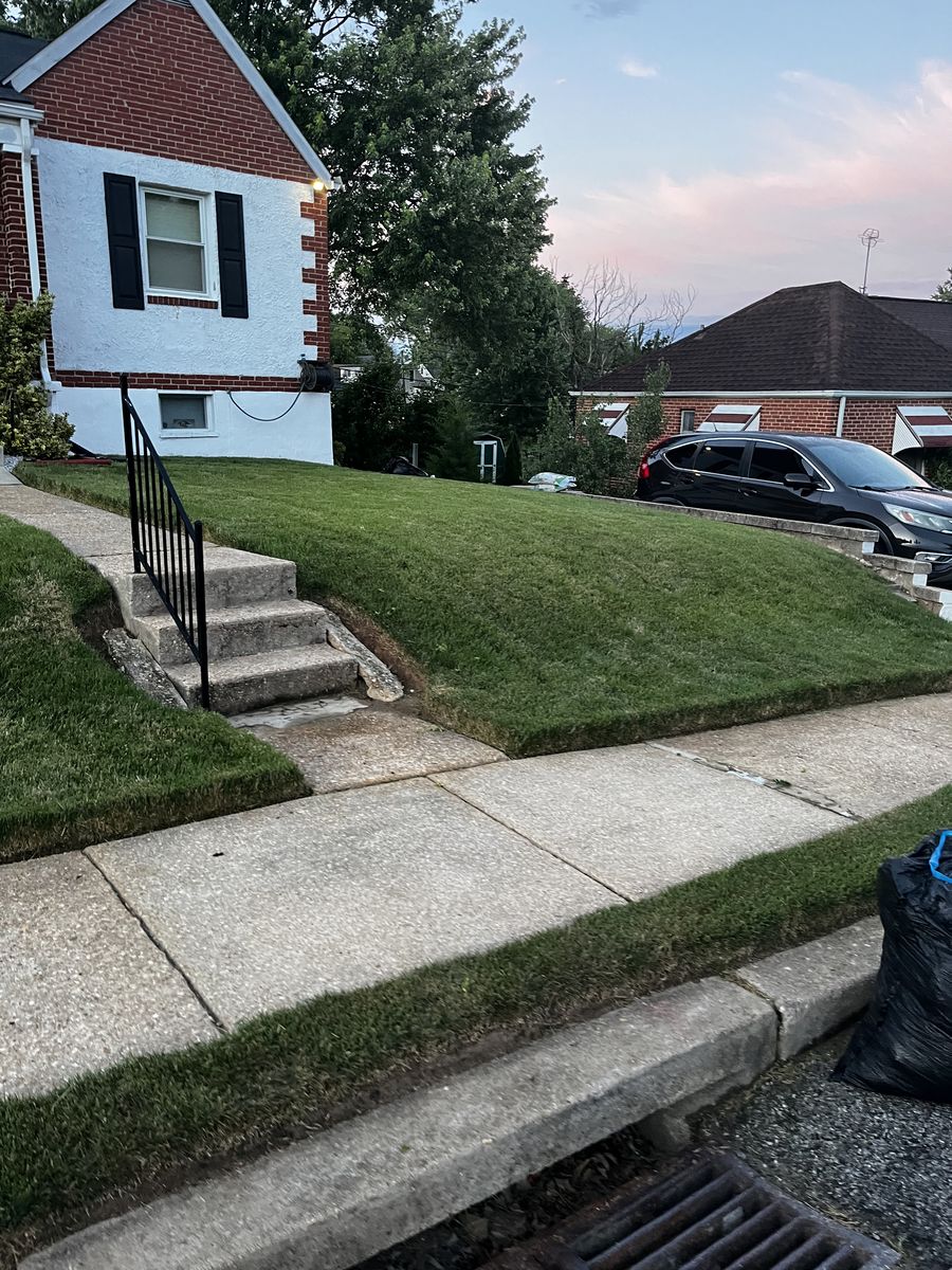 Fresh-cut front lawn at a Baltimore home after service